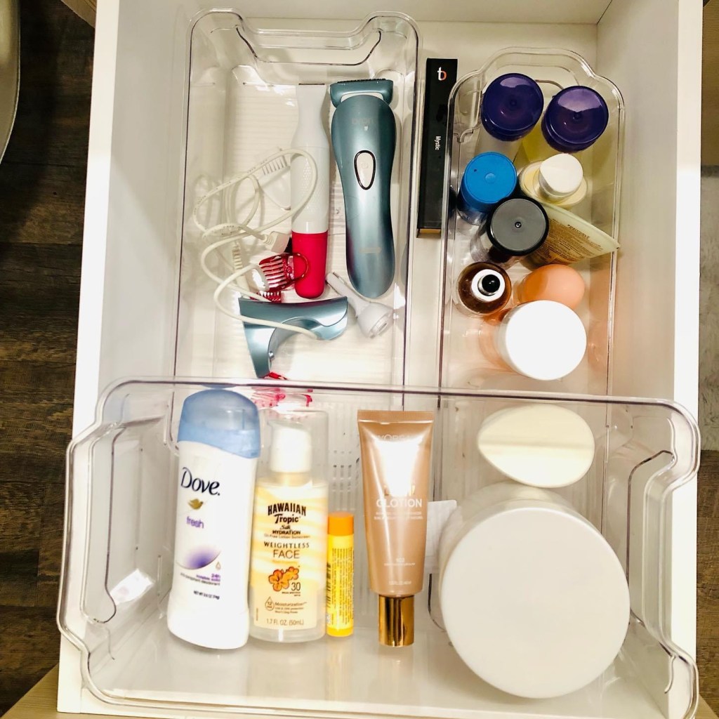 A well-organized drawers with clear acrylic deviders and organized systmes. 